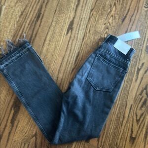 EB Denim Distressed  black denim jeans with a frayed and slit  hem. NWT size 23.